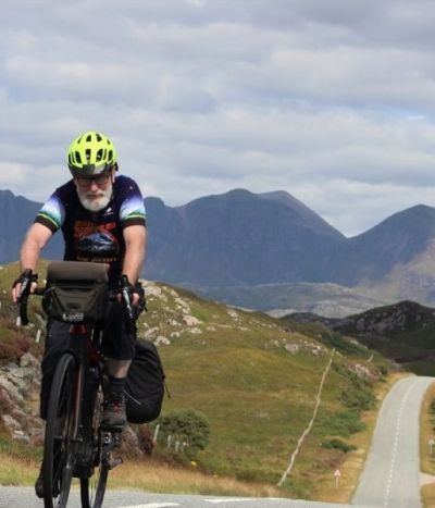 John Lingford Cycling on the  tour with redspokes